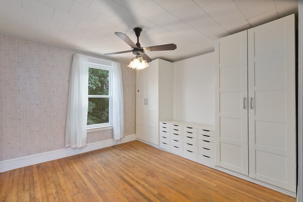 16 Silver Street Haverhill, MA 01832 - Photo 12 of 16 a view of an empty room with a window and wooden floor
