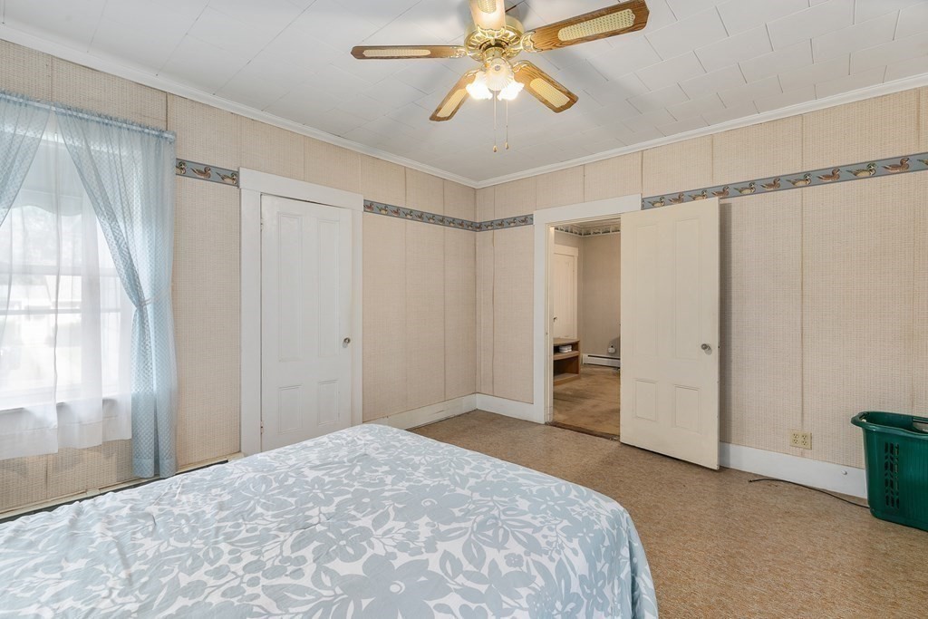 16 Silver Street Haverhill, MA 01832 - Photo 9 of 16 a bedroom with a bed and a chandelier fan