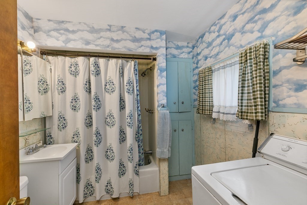 16 Silver Street Haverhill, MA 01832 - Photo 10 of 16 a bathroom with a sink a toilet and shower