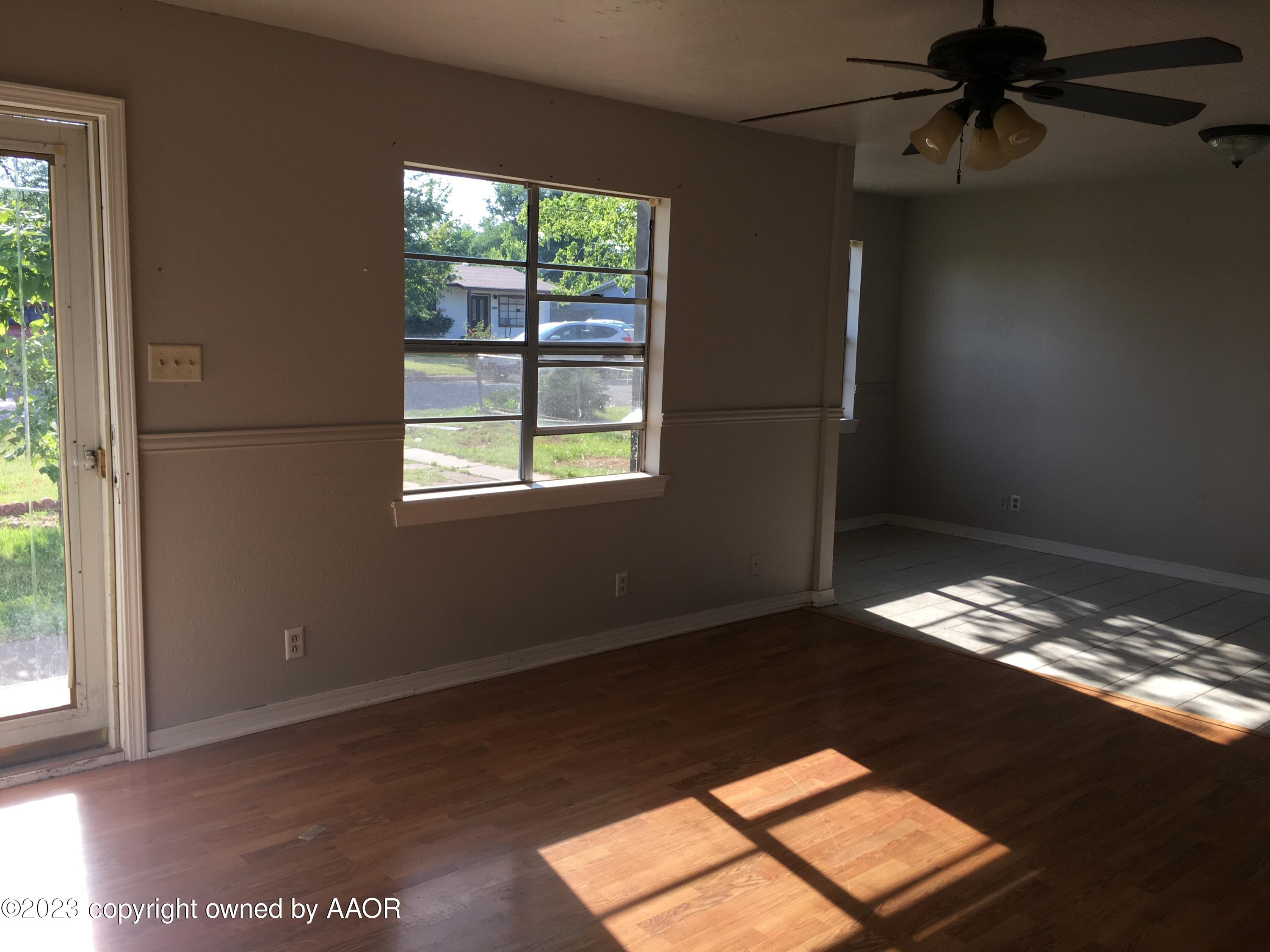 4415 South Hayden Street Amarillo, TX 79110 - Photo 2 of 7 a view of an empty room with a window