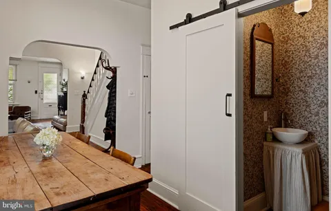 a view of a hallway with furniture and front door