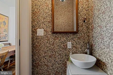 a bathroom with a toilet and a shower curtain