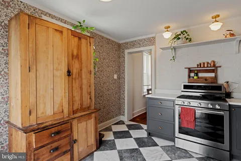 a kitchen with a refrigerator and cabinets