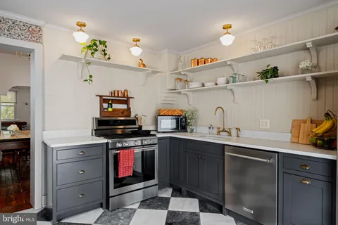 a kitchen with cabinets and window