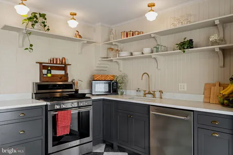 a kitchen with cabinets and appliances
