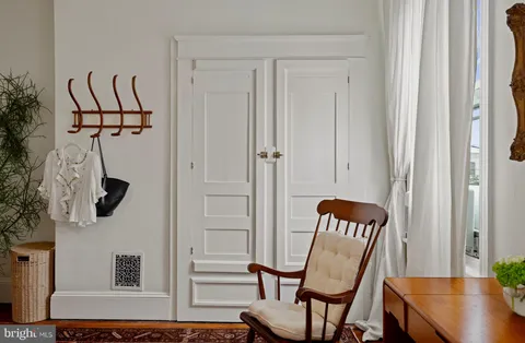 a view of a hallway with seating area