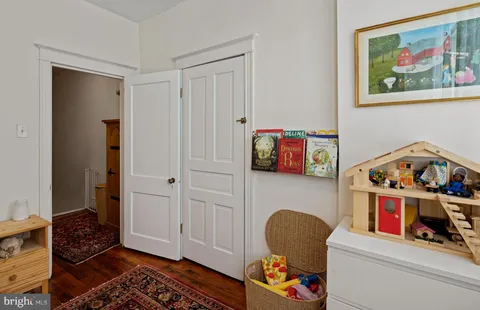 a room with toys and dresser