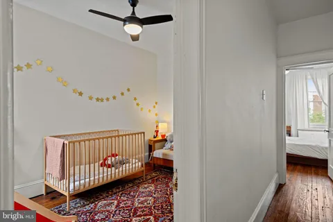 a living room with furniture and stairs