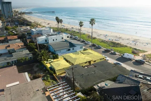 an aerial view of a house with a swimming pool