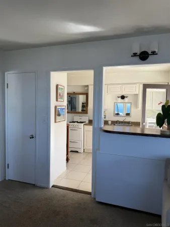 a kitchen with a sink a stove and a refrigerator