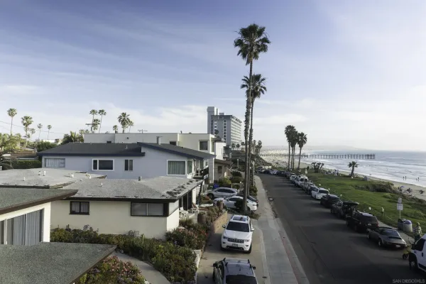 a view of residential houses with outdoor space