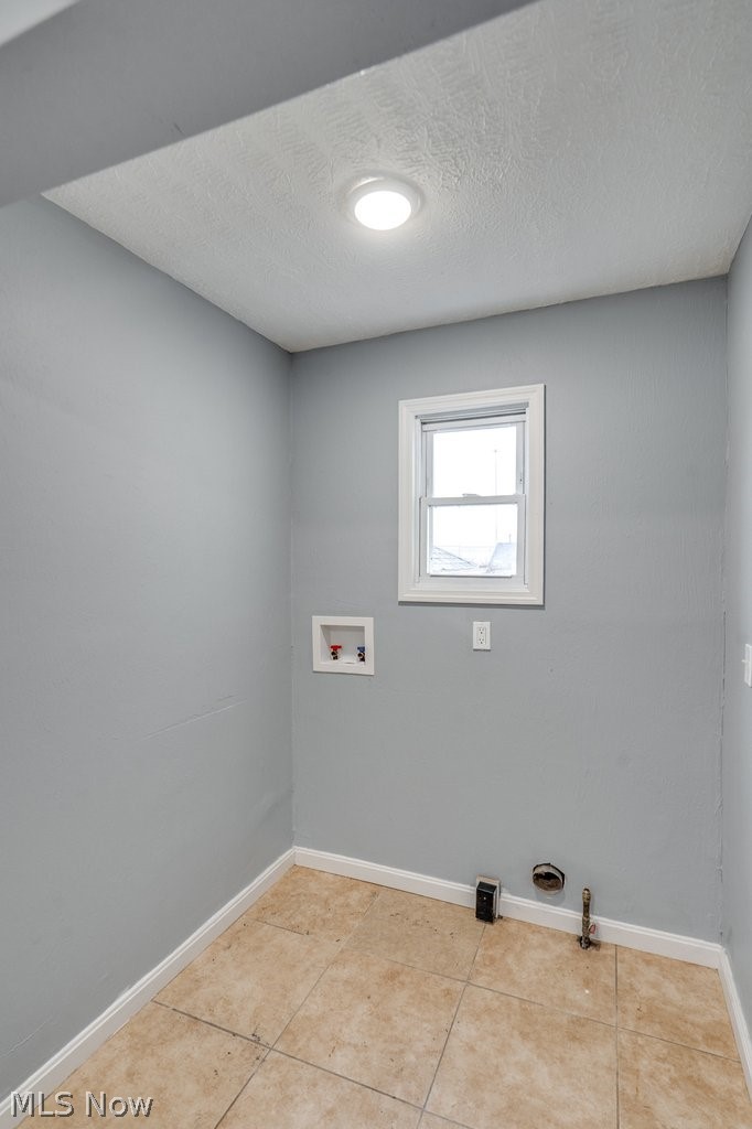 1607 9th Street Southwest Canton, OH 44706 - Photo 21 of 41 Laundry area featuring tiled flooring, a single window, recessed lighting, and wall hookups for appliances