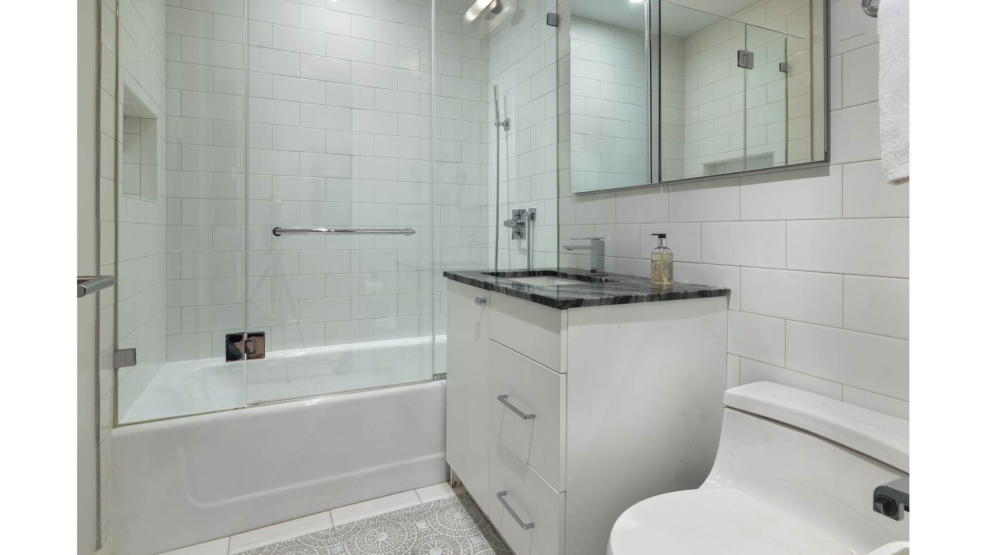 433 East 74th Street, Unit TH/1B Manhattan, NY 10021 - Photo 10 of 15 a bathroom with a granite countertop sink toilet and shower