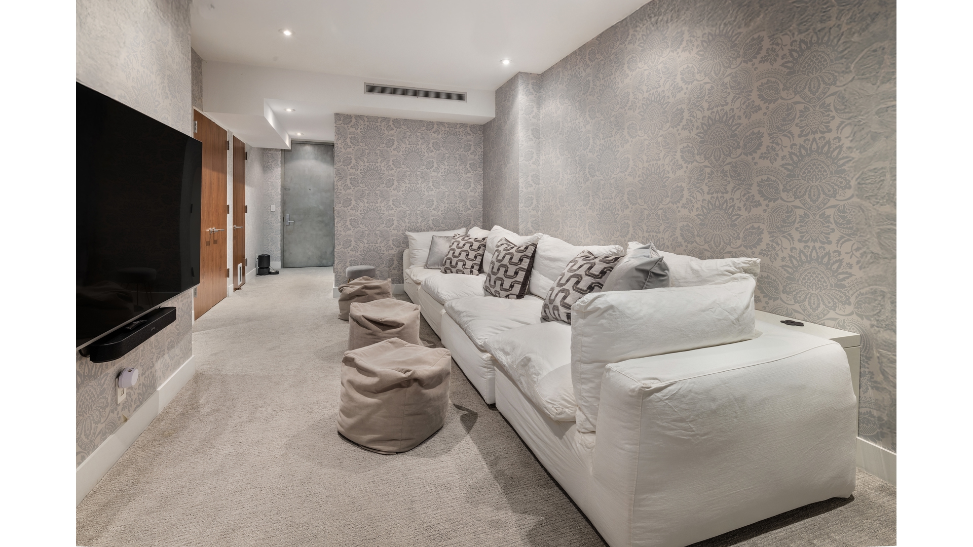 433 East 74th Street, Unit TH/1B Manhattan, NY 10021 - Photo 11 of 15 a living room with furniture and a flat screen tv
