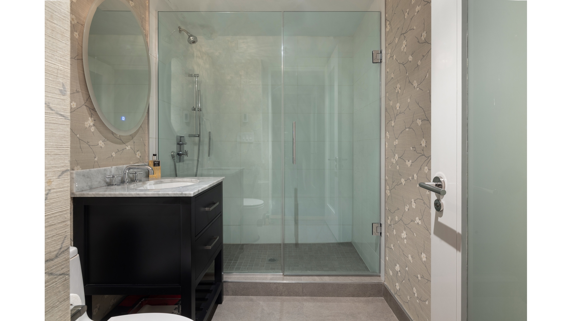 433 East 74th Street, Unit TH/1B Manhattan, NY 10021 - Photo 14 of 15 a bathroom with a sink and a mirror