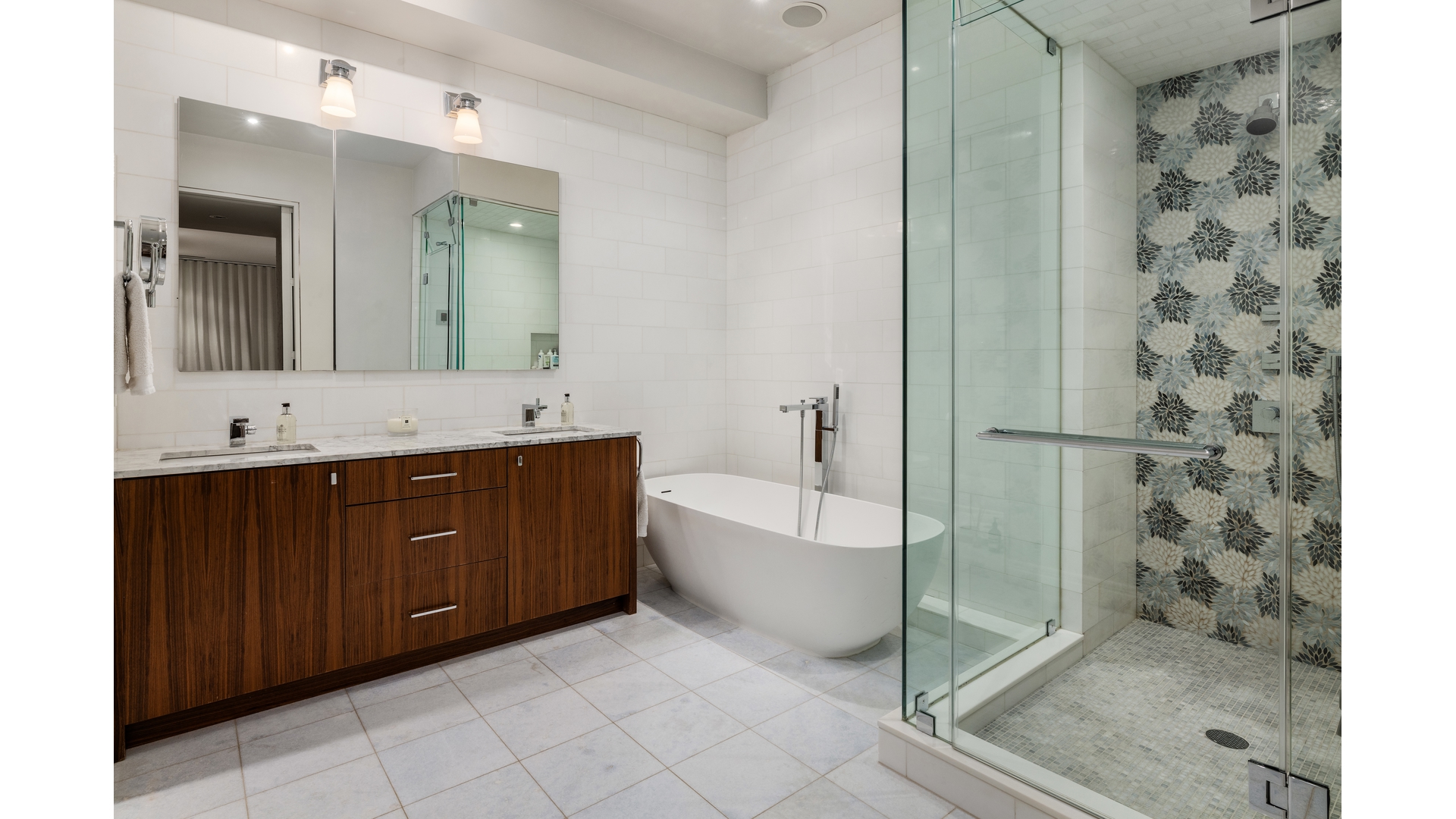 433 East 74th Street, Unit TH/1B Manhattan, NY 10021 - Photo 7 of 15 a spacious bathroom with a double vanity sink toilet mirror and bathtub