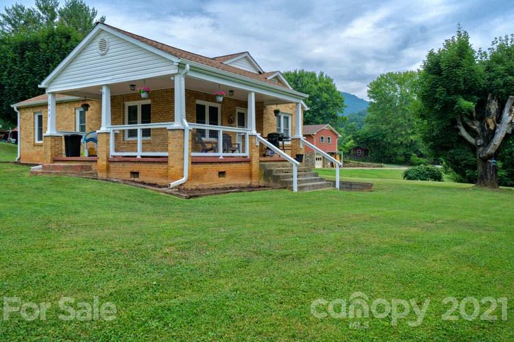1943 Beaverdam Road Canton, NC 28716 - Photo 1 of 31 a view of a house with a yard and sitting area