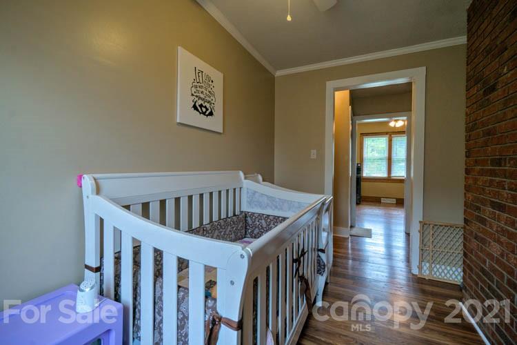 1943 Beaverdam Road Canton, NC 28716 - Photo 12 of 31 a view of a hallway with wooden floor and stairs