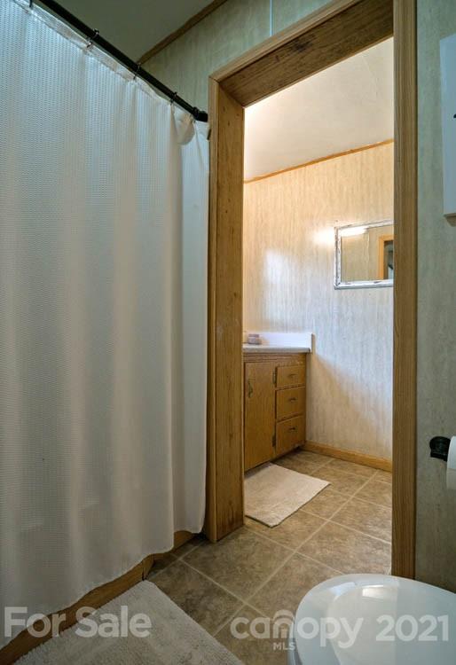 1943 Beaverdam Road Canton, NC 28716 - Photo 13 of 31 a bathroom with a sink and a mirror