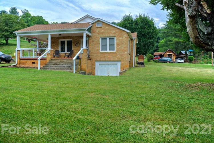 1943 Beaverdam Road Canton, NC 28716 - Photo 18 of 31 a front view of a house with a yard