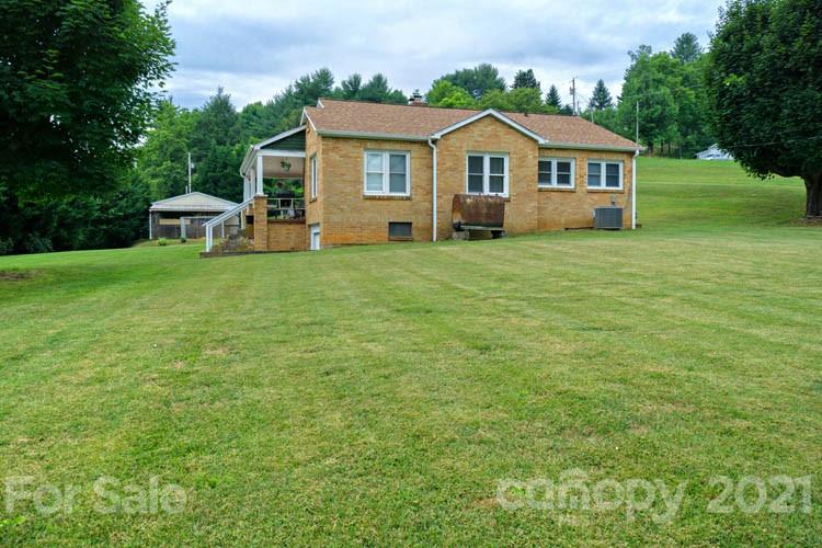1943 Beaverdam Road Canton, NC 28716 - Photo 19 of 31 a front view of a house with a garden