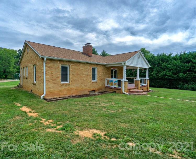 1943 Beaverdam Road Canton, NC 28716 - Photo 21 of 31 a backyard of a house with table and chairs