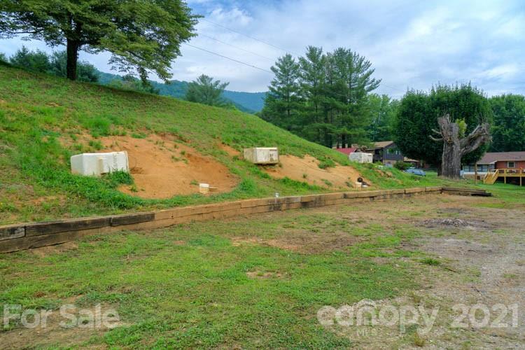 1943 Beaverdam Road Canton, NC 28716 - Photo 26 of 31 a backyard of a house with lots of green space