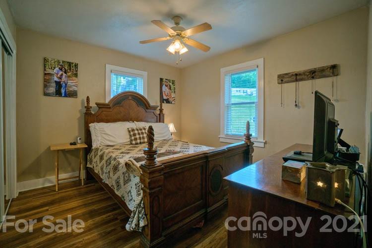 1943 Beaverdam Road Canton, NC 28716 - Photo 8 of 31 a bedroom with a bed and a desk