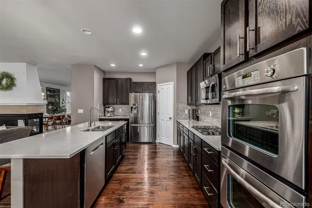 a large kitchen with stainless steel appliances