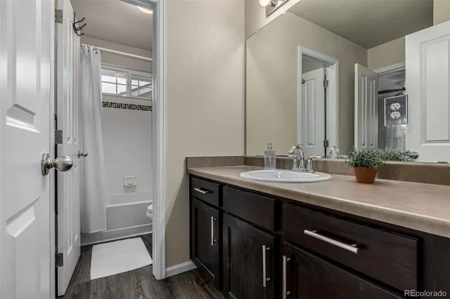 a bathroom with a sink double vanity and a mirror