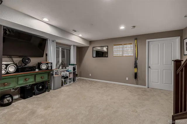 a view of a livingroom with furniture and a window