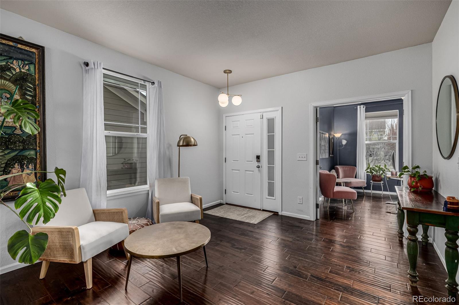 1138 Mircos Street Erie, CO 80516 - Photo 5 of 46 a living room with furniture and a wooden floor