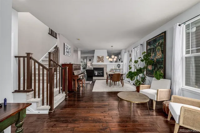 a view of a dining room with furniture window and wooden floor