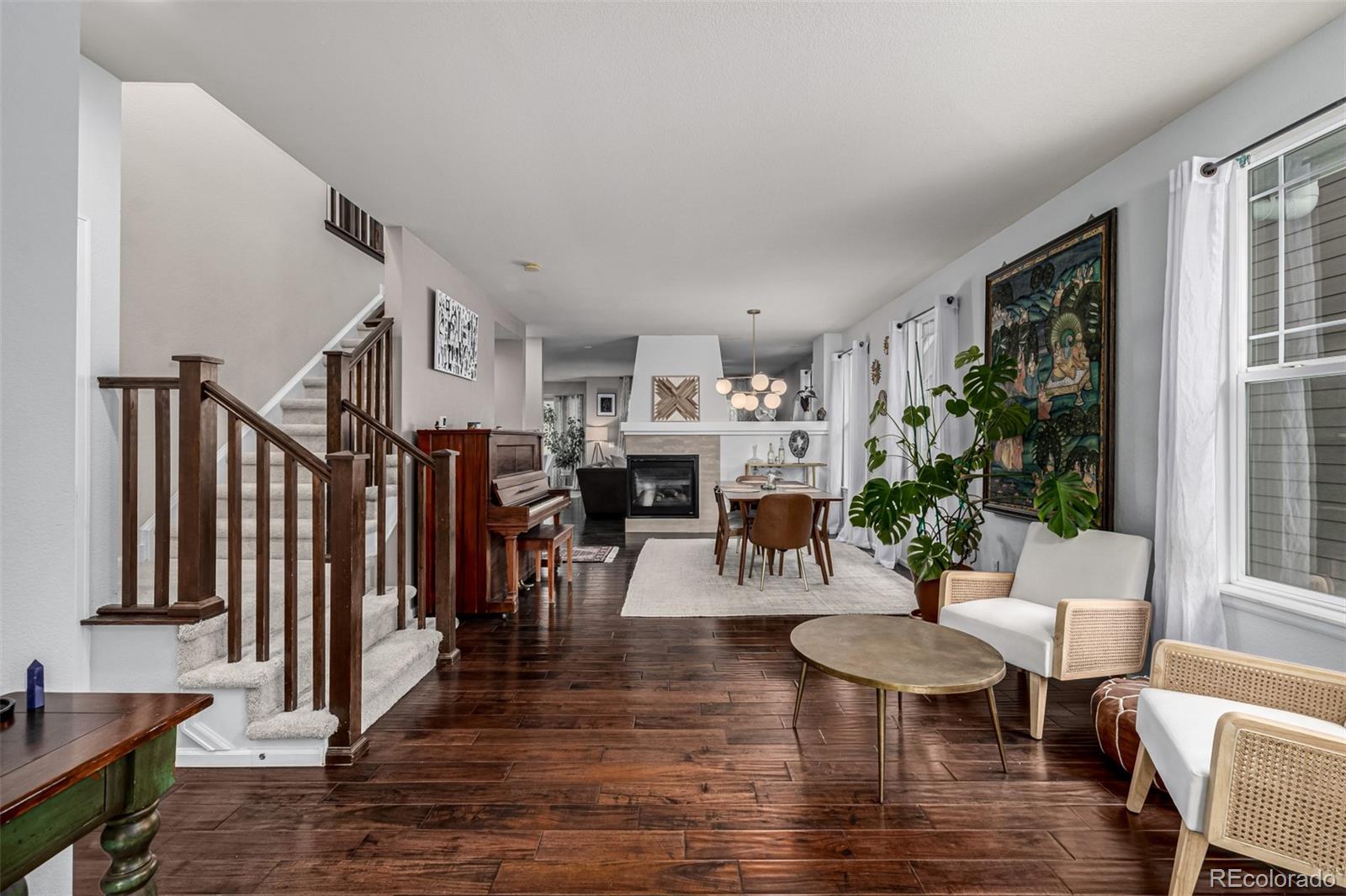 1138 Mircos Street Erie, CO 80516 - Photo 7 of 46 a view of a dining room with furniture window and wooden floor