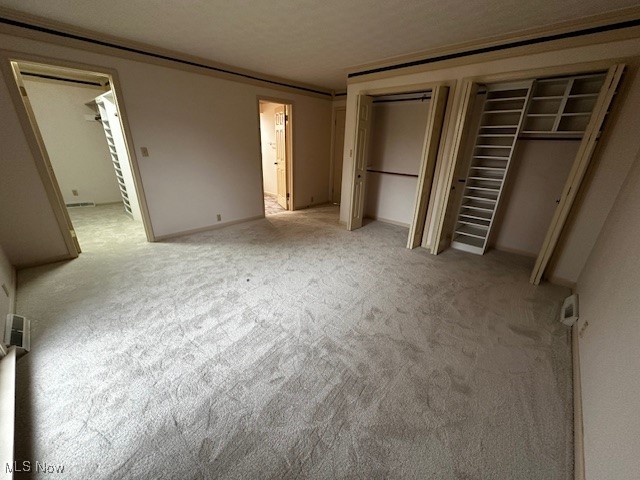 3508 Miller Road Sandusky, OH 44870 - Photo 20 of 30 Unfurnished bedroom featuring multiple closets and carpet
