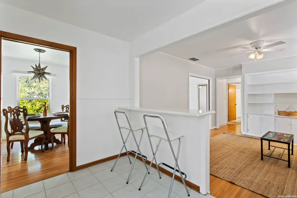 a view of a livingroom with furniture and hardwood floor