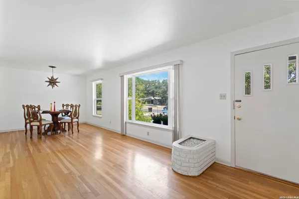 a view of dining room with furniture and window