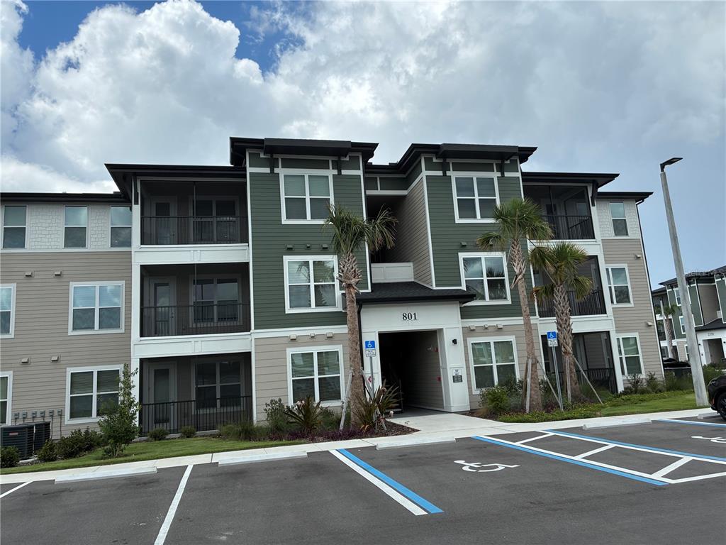 801 Naval Ave Mount, Unit 2203 Mount Dora, FL 32757 - Photo 1 of 16 a front view of a house with yard