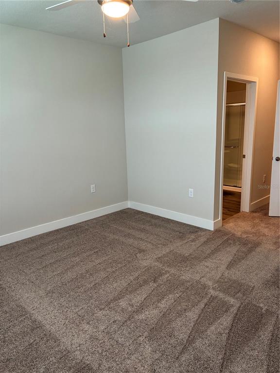 801 Naval Ave Mount, Unit 2203 Mount Dora, FL 32757 - Photo 11 of 16 a view of an empty room and closet area