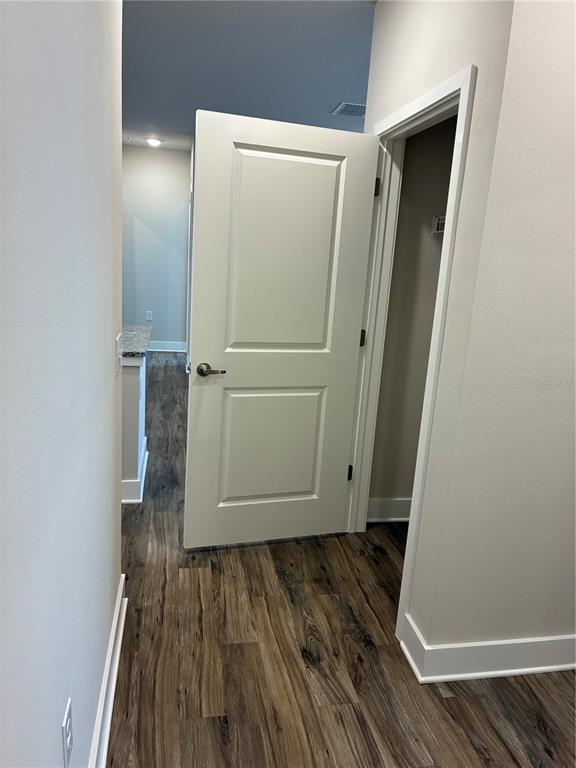 801 Naval Ave Mount, Unit 2203 Mount Dora, FL 32757 - Photo 6 of 16 an entryway door with wooden floor