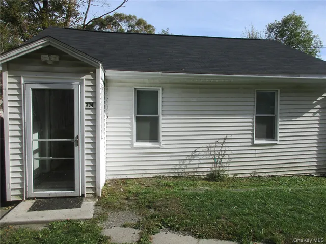 a front view of a house with garage