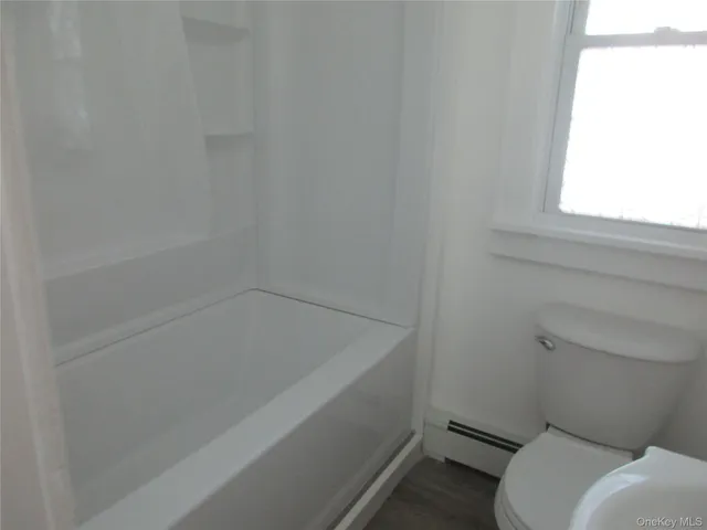 a bathroom with a sink and toilet