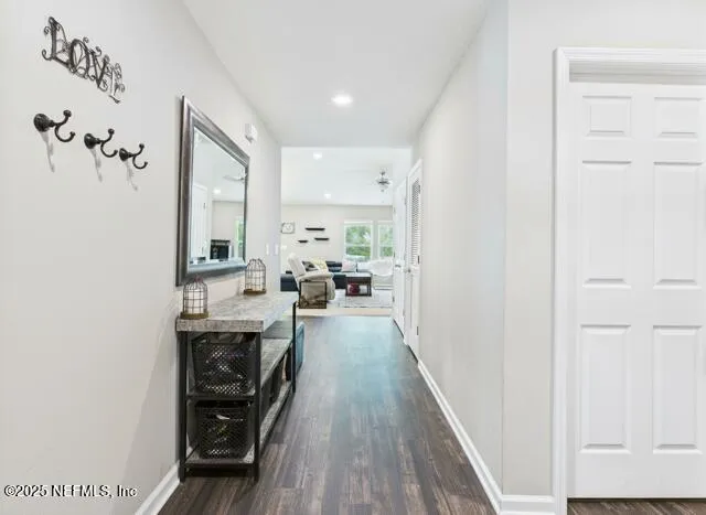 a bathroom with a sink a toilet and shower curtain