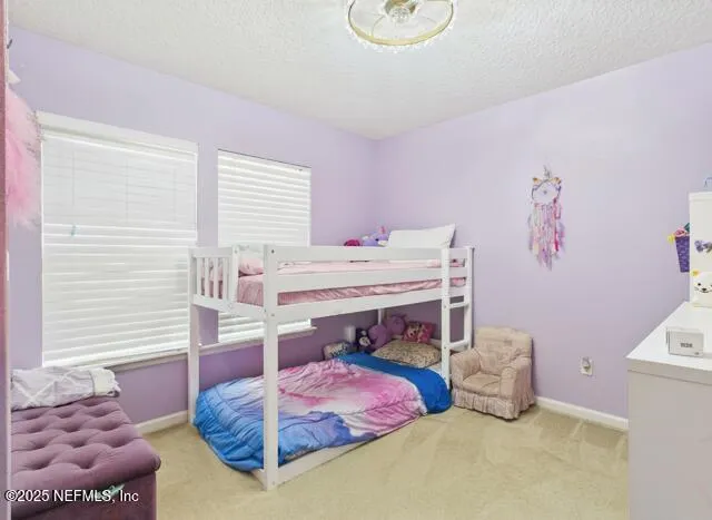 a bathroom with a granite countertop sink a mirror a bathtub and shower