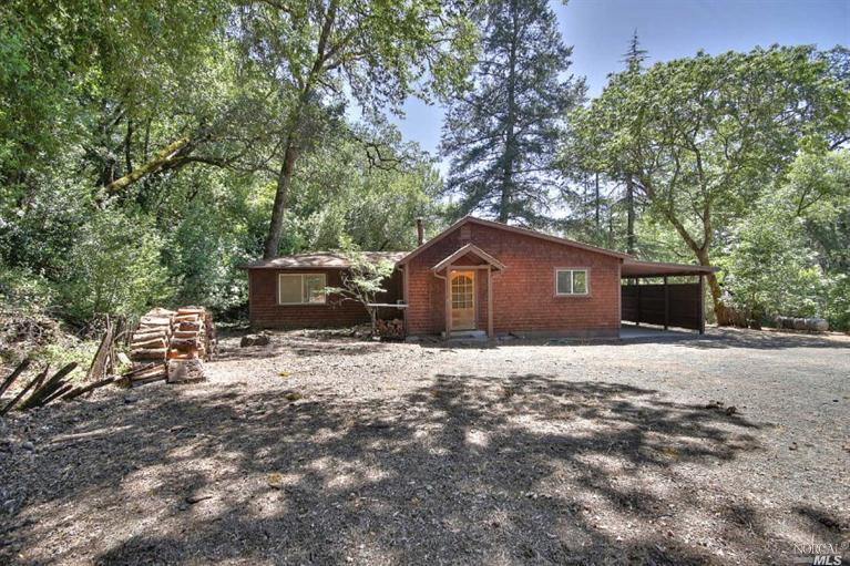 3120 Porter Creek Road Santa Rosa, CA 95404 - Photo 1 of 1 a front view of a house with a yard and garage