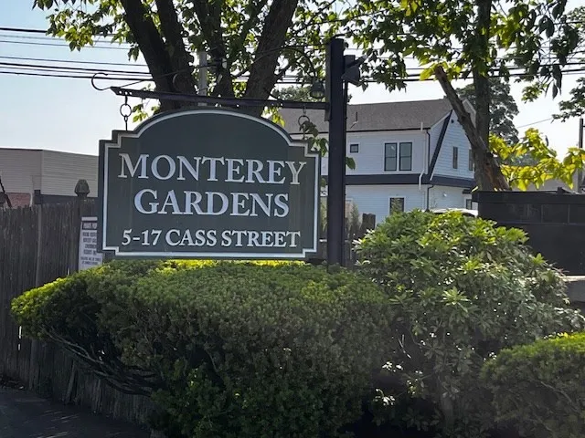 a view of outdoor space with signage and flags