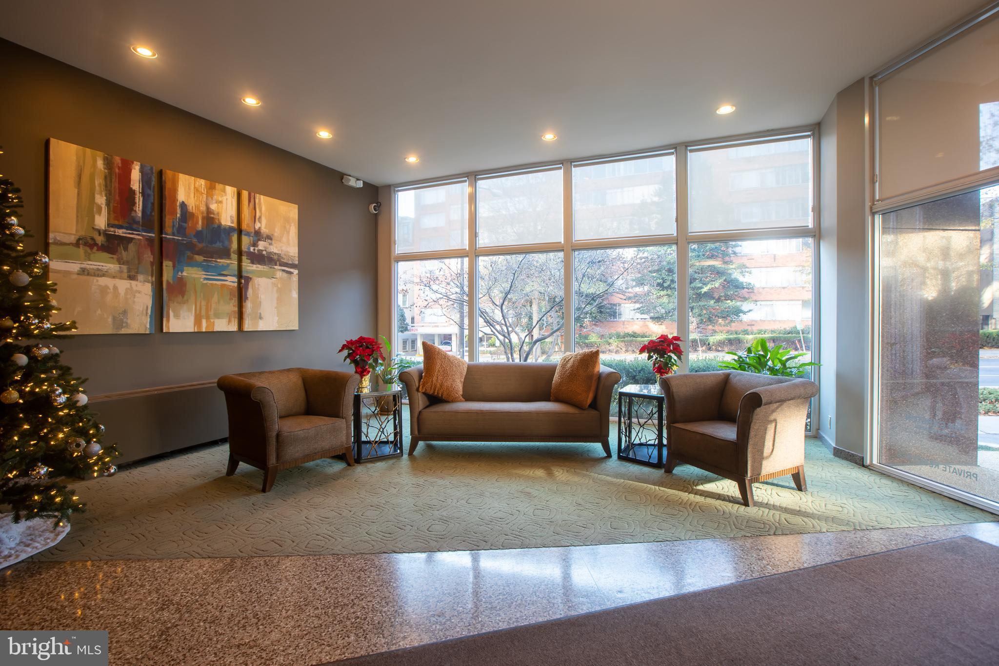 2829 Connecticut Avenue Northwest, Unit 505 Washington, DC 20008 - Photo 4 of 17 a living room with furniture and a large window