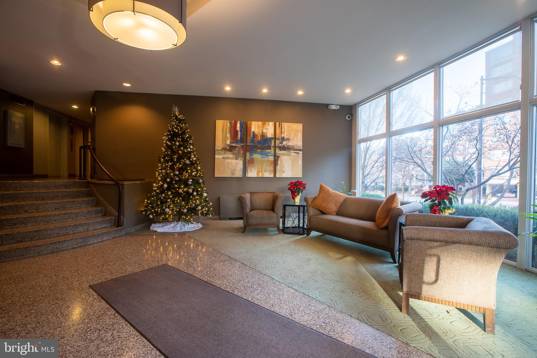 2829 Connecticut Avenue Northwest, Unit 505 Washington, DC 20008 - Photo 5 of 17 a living room with furniture and a large window
