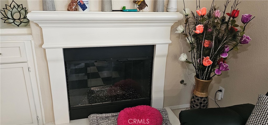 1650 Ravenswood Road Beaumont, CA 92223 - Photo 17 of 42 a hallway with a flower pot and a fireplace