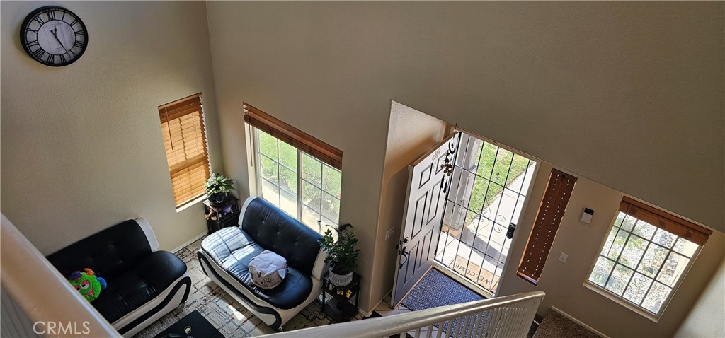 1650 Ravenswood Road Beaumont, CA 92223 - Photo 21 of 42 a living room with furniture and a window